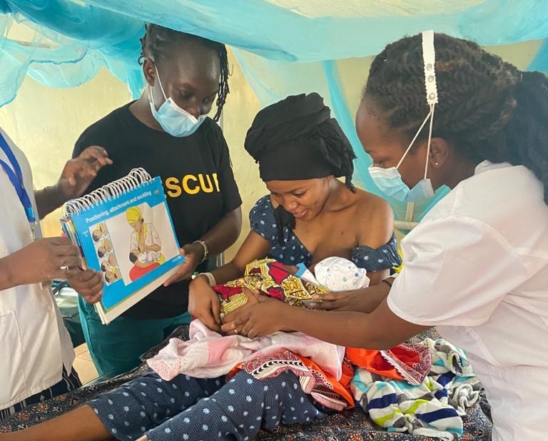 Ms. Annes Mboya and her colleagues providing breastfeeding counseling to a mother, Kakuma Refugee Camp